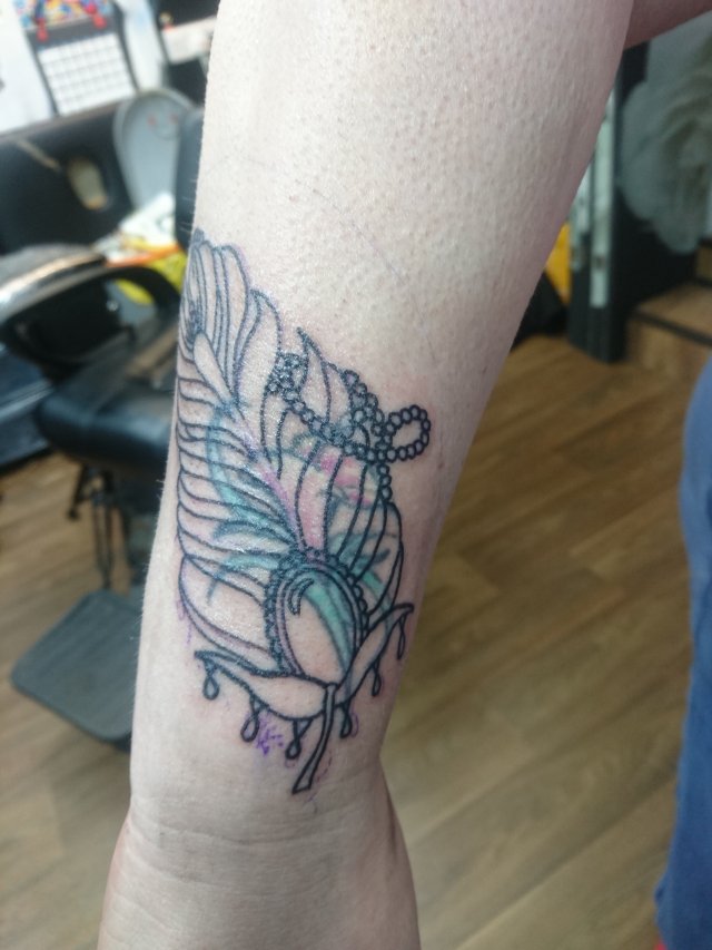 tattoo, lily-tattoo, floral-tattoo, tattoo-flowers, tattoo-coverup, cover-up, tattoo-by-thor, thor-gratts, mad-tatters, perfume-bottle, vintage-style-tattoo, peacock-feather, quarter-sleeve, wrist-tattoo, flowers-bottle-feather-tattoo