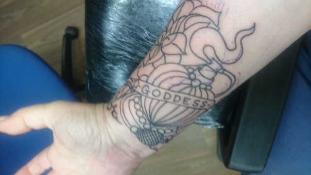 tattoo, lily-tattoo, floral-tattoo, tattoo-flowers, tattoo-coverup, cover-up, tattoo-by-thor, thor-gratts, mad-tatters, perfume-bottle, vintage-style-tattoo, peacock-feather, quarter-sleeve, wrist-tattoo, flowers-bottle-feather-tattoo